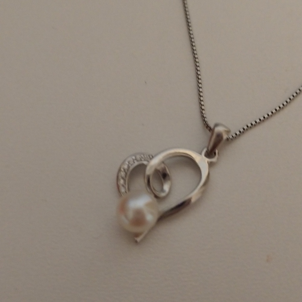 Silver, pearl, and crystal necklace